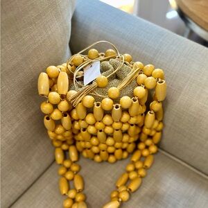 Vanina Wooden Beaded Shoulder Bag with metallic drawstring insert